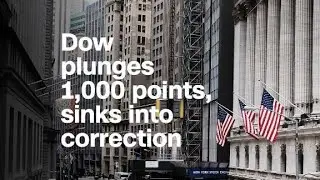 Dow plunges 1,000 points and sinks into correction