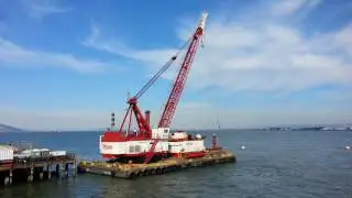 Ferry Ride View Manson Crane on Barge in the San Francisco Bay Ferry Building..