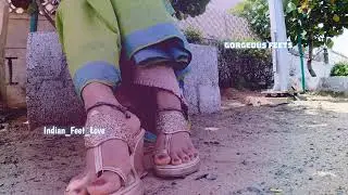 Indian Feet in Saree shows her feet painted in red wearing wedges