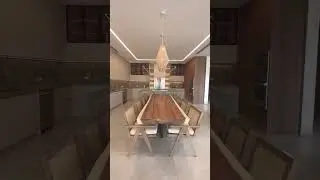 huge dining table with kitchen