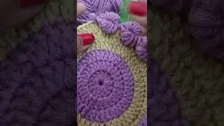 Cute little crochet heart on coaster 