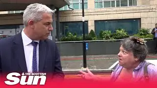 Moment Health Minister blasted by member of the public as she interrupts TV interview