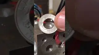 Folding quarter coin rings with a ball bearing and a Doming Block