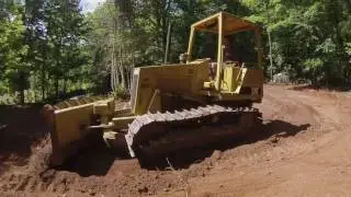 cat d4c dozer pushing dirt