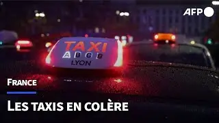 À Lyon, des centaines de taxis en colère occupent la place Bellecour | AFP