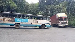 Heavy container truck and ksrtc bus Turning Seventh Hairpin bend Thamarassery Ghat Kerala india 