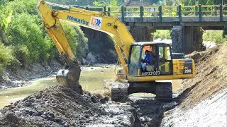 Digger Excavator Clearing The River Bank Komatsu PC200