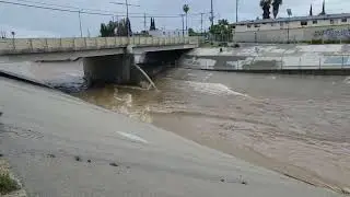 Los Angeles River headwaters flood control channel after 24hrs of rain. Mason Ave Bridge