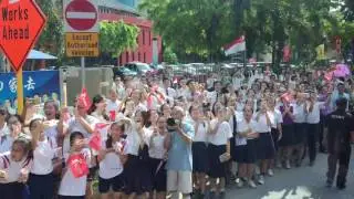 Schooling bus parade passes by Dunman High School
