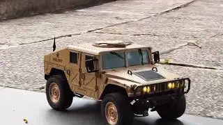 Four-wheel drive remote-controlled Hummer SUV conquers all terrains, from sandy beaches to muddy 
