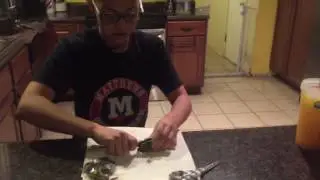 Akoya oyster opening with black pearl inside