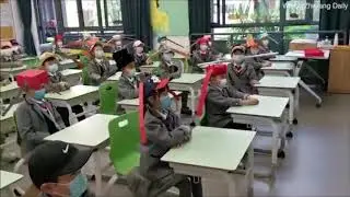 Chinese children must wear 'one-metre hats' to keep social distancing in class