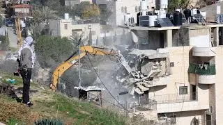 Israel demolishing a four-story residential building in Wadi Qadum, East Jerusalem, 22 December 2025