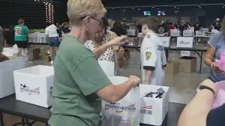 Volunteers at Operation Gratitude assemble care packages to thank newest military service members