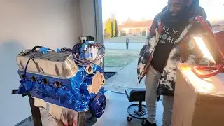 Juan seeing his 302 Ford motor for the 1st time after i finished painting it