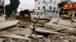 Giant hydropower dam releases floodwaters, China sinks deep under mud; Ragasa devastate Guangdong.
