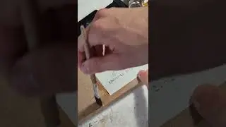 Gluing the soundhole label