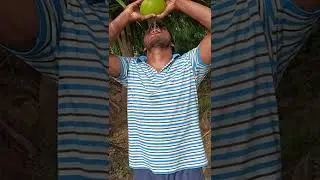 village boy Breaking a coconut with hands