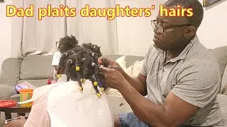 Dad cares for daughters' hair!
