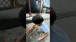 Trying to make castle with sand for Nene (Mumma)