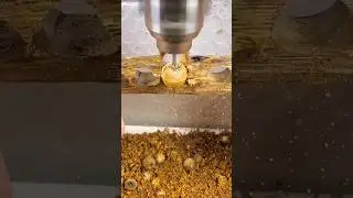 Worker ensures accurate drilling during woodworking projec