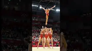 #ArtisticGymnastics #GymnastTeam #AcrobaticGirls #HumanPyramid #FemaleAthletes #SportsArena