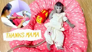 Annie Monkey is happy to sew with her mother