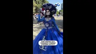 Fan dressed as Dodgers-themed La Calavera Catrina attends team's parade