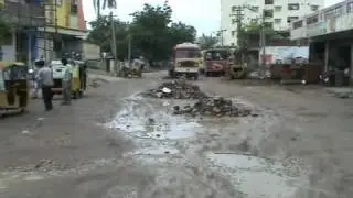 Municipal Corporation Karimnagar A P, INDIA officials covered pothole with huge waste dust and big concrete stone on  07 08 2010 at Kaman To Rose Theatre Road, Karimnagar A P