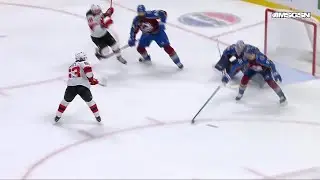 Jack Hughes scores a goal against the Colorado Avalanche