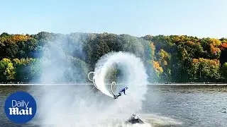 Russian woman performs incredible flyboard somersault over lake