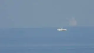 Reverse zoom on boat disappearing bottom first