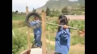 Farmers building well water pump from scratch