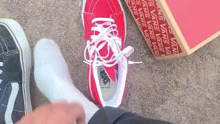 Red and black Vans SK8-Hi