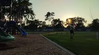 Standing triple jump at a playlot