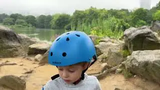 Boy Rides Over the Bow Bridge in Central Park