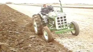 550 Oliver tractor with 2 bottom mounted Oliver plow