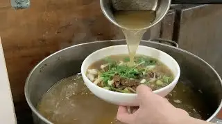 Chinese Street Food - Hot  Sliced noodles with pickles in Hefei China