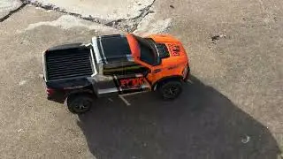 TRAXXAS RAPTOR R 4X4 ULTIMATE EDITION DOING DRIFF TURNS AND DONUTS AND CHASING CARS