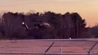 Sunset landing and take off of a Boeing AH-64E Apache Guardian.
