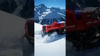 A tracked rescue vehicle climbing snowy mountains.