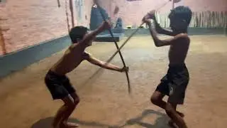 Kalaripayattu kids long stick fighting