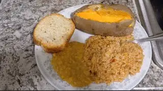 Cooking Mexican Rice, baked potato, cream style corn, and garlic bread #vegan #vegetarian #Cooking 