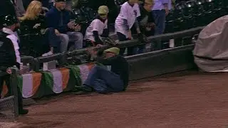 MIN@CWS: Fan falls onto field after chasing foul
