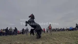 Romanian villagers mark Epiphany in the foggy south of the country