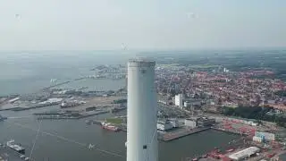 Aerial view flying around the chimney of Esbjerg Power Station in Denmark. Drone view orbit