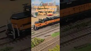 HO Scale Milwaukee Road SD10 Mixed Freight Train Passes Industrial Yard!