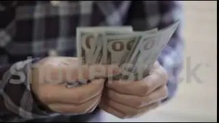 Man's hands counting money dollar bills.close up