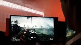 Kai plays a video game with EA CEO Andrew Wilson