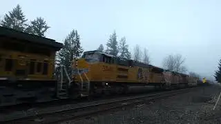 (NB) UP 6028 leads a Manifest Train / M-SEPD through the Thomsen Road Southeast Railroad Crossing.